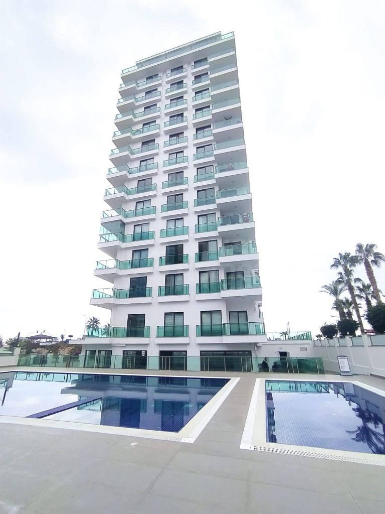 SUNSET AQUA Furnished 2+1 apartment in front of the sea in Mahmutlar id 6553