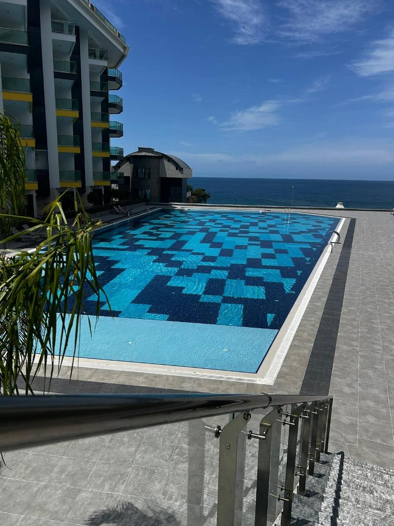 KONAK SEASIDE PREMIUM Furnished 1+1 apartment in front of the sea in Kargicak id 7657